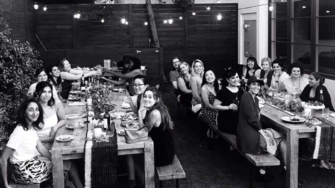 Women sitting at two dining tables